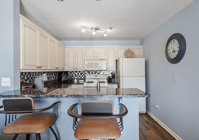 Building Photo - Bright & Spacious 2BR/2BA Condo with Covered Parking Near Train Station