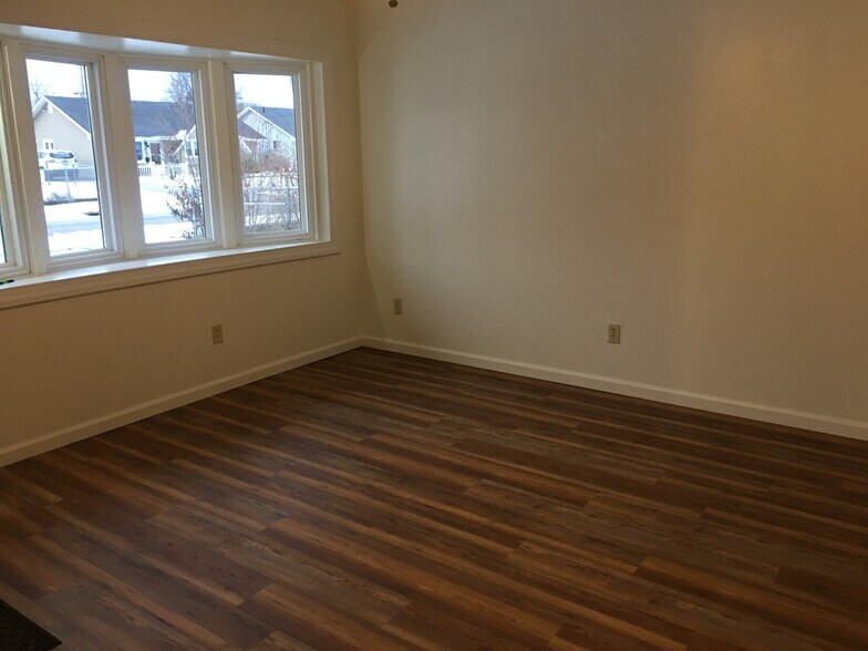 Living Room Features Large Bay Window & Vinyl Plank Flooring - 4251 Brockley Ave