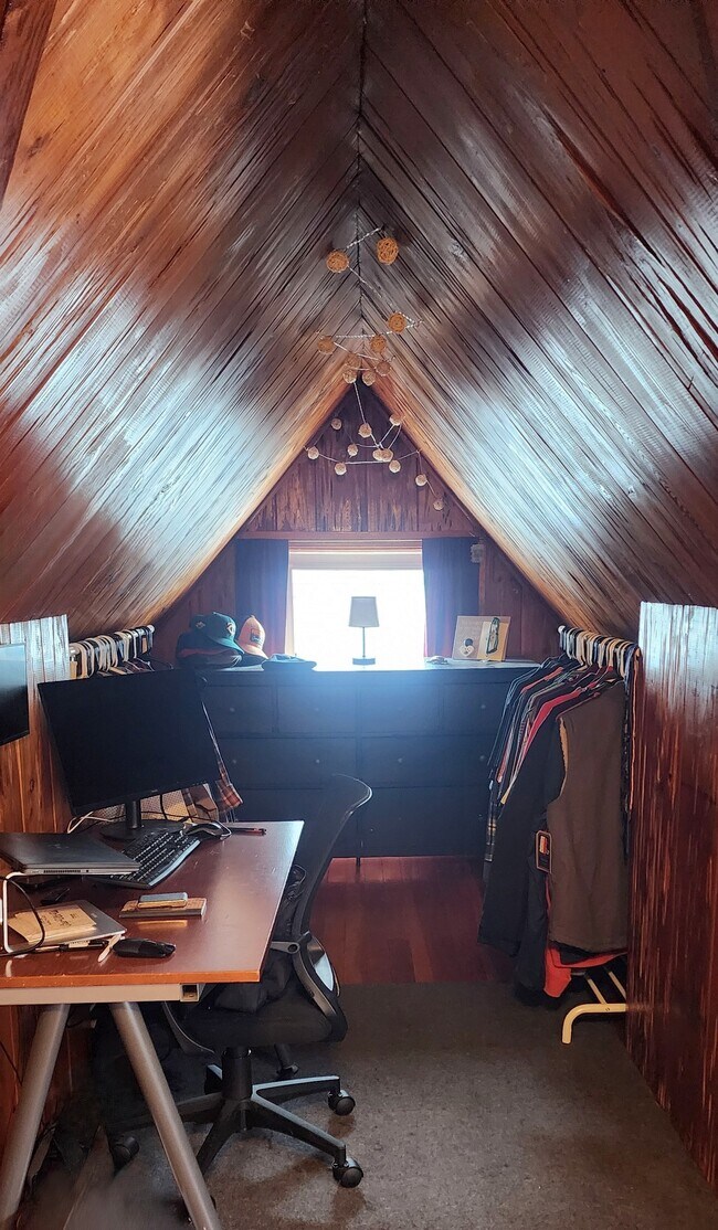 Alcove shown as a functional home office with natural light. - 2923 Arthur St NE