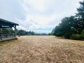 Building Photo - Majestic Farmhouse Retreat on 39 Acres with Sweeping Ocean Views