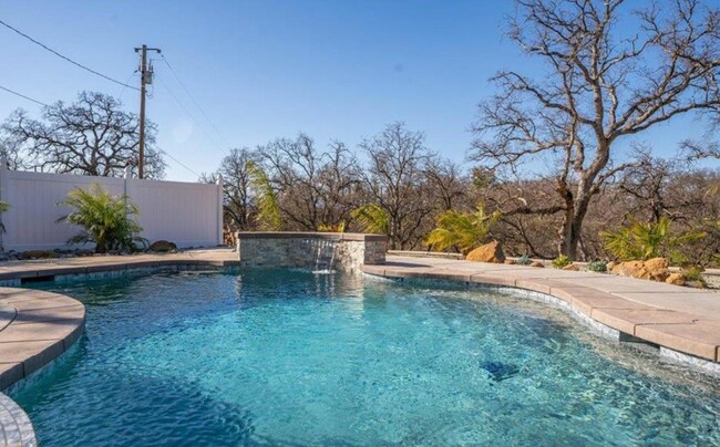 Building Photo - A Private Oasis with Unmatched Amenities 4 Bedroom 3 Bath