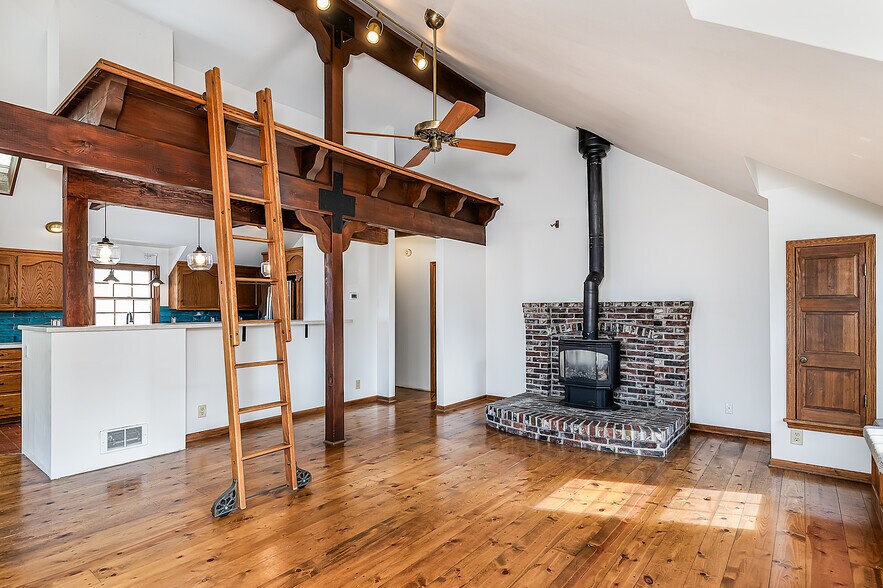 Living room with terrace and working Franklin stove - 22224 98th Ave W