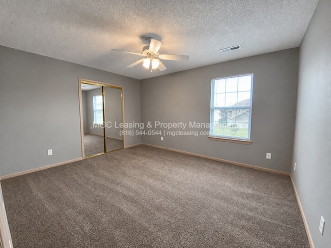 Building Photo - Inviting Harrisonville Townhome with Attached Garage & Cozy Fireplace