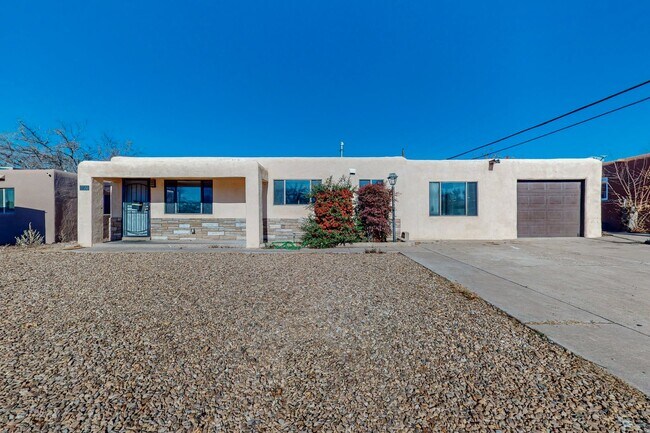 Building Photo - NE PUEBLO STYLE 3 Bedroom 2 Bath 1824/SF