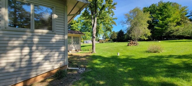 Building Photo - Beautiful home with peek a boo views of West Bay on Old Mission Peninsula