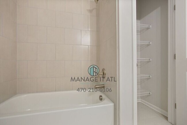 Building Photo - Modern 3-level Townhome featuring 4 bedroo...