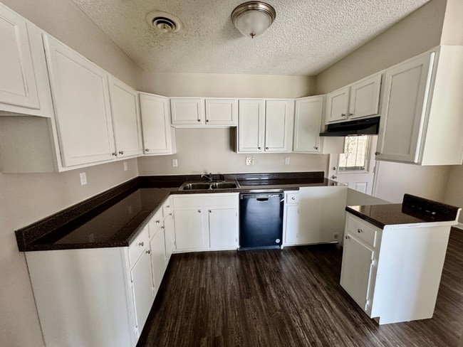 Building Photo - Charming 3BR/2BA Near Southwind | Soaring Vaulted Ceilings, Brick Fireplace & Fenced Yard