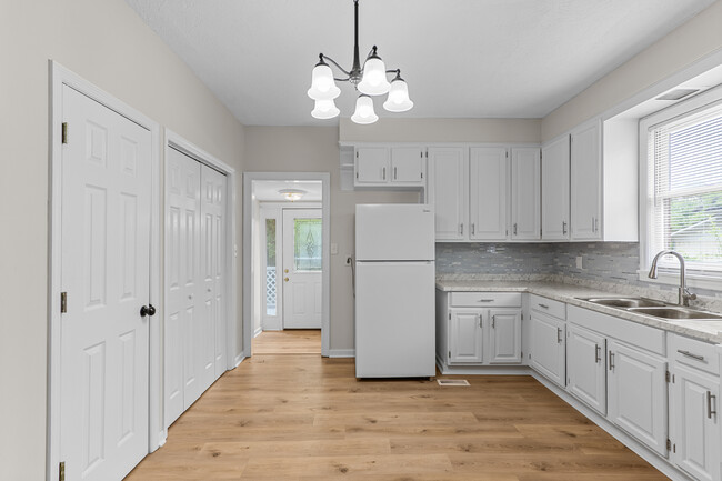 Laundry closet and kitchen area - 796 Leitner St