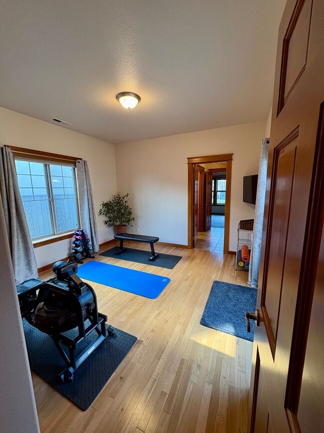 Building Photo - Spacious Luxury Home with Hardwood Floors & Outdoor Living