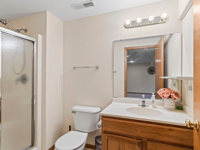 Building Photo - Spacious 3BR/3BA Condo with Finished Basement + 2-Car Garage — Available Now