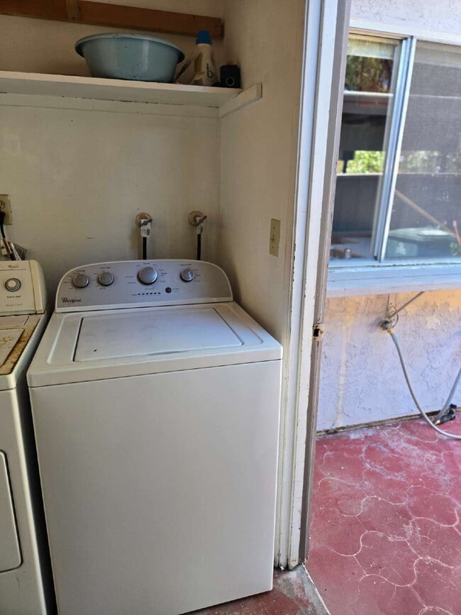 Building Photo - A spacious 3-bed, 2-bath condo is convenie...