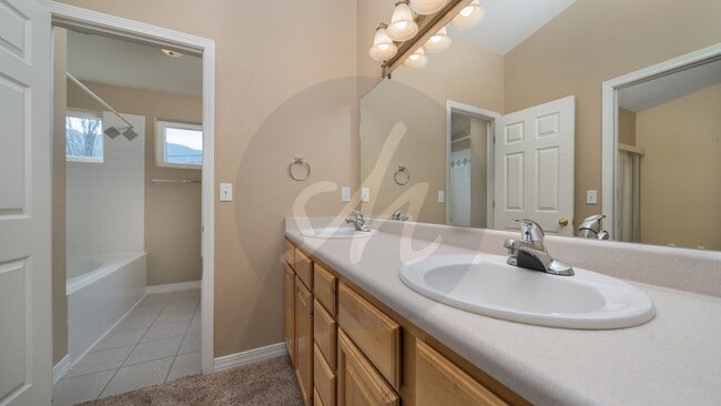 Building Photo - Spacious 3BR Townhome with 2-Car Garage & Private Covered Balcony