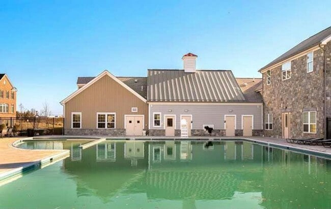 Building Photo - Immaculate & Stunning 3 Bedroom 2.5 Bathroom Brick, End-Unit Condo Style Townhome In Luxurious An...