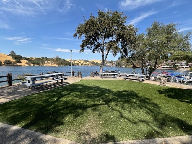 Building Photo - Move in special: $500 off first months rent! Home located in a gated Lakefront community with 3 s...