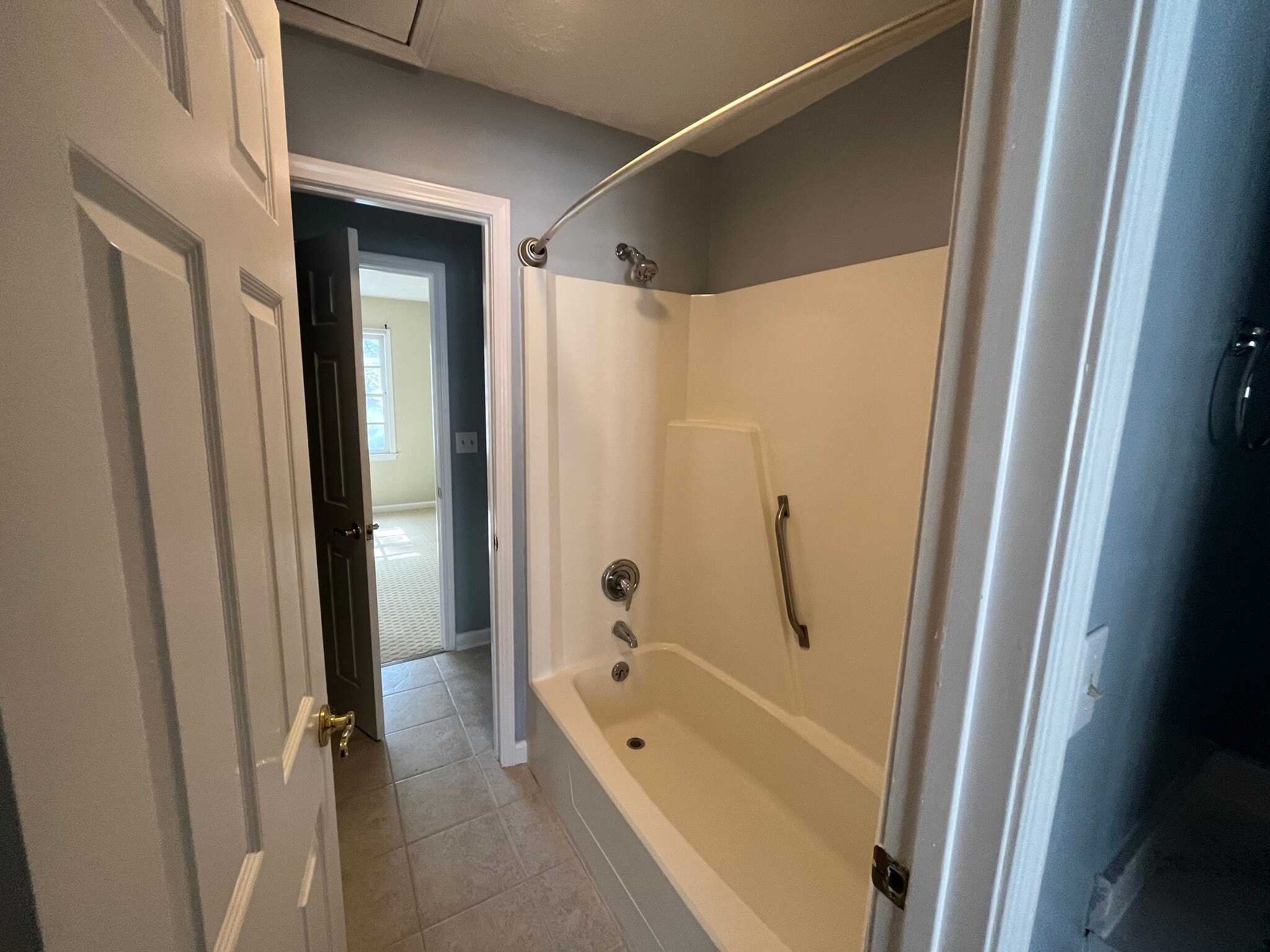 "His and her" bathroom between the bedrooms features a shower/bath and two half baths - 830 44th Ave N