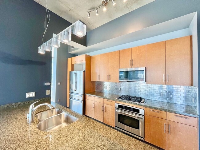 Building Photo - Stunning Corner Loft in East Village with Floor-to-Ceiling Windows & City Views!