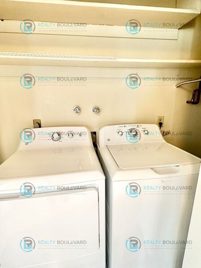 Building Photo - 2-bed, 2-bath, 2-story townhome with pool and park like setting outside the front door.