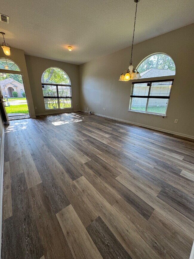 Building Photo - Spacious 4 Bedroom Pond-View Home with Upg...