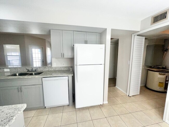Building Photo - NEW-Remodeled bathroom & kitchen! NEW VINYL PLANK flooring & fresh paint! 2 bedroom 1 bath condo ...