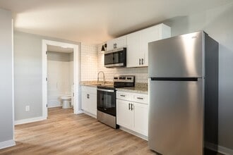 Building Photo - Discover Modern Living at Genesis Apartmen...