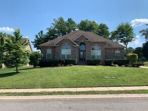Building Photo - Luxury Living! Beautiful Brick Home in Sango with 3 car garage.