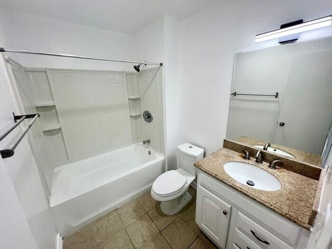 Building Photo - Stunning 4BR Townhome with Hardwood Floors, Private Patio, Community Pool & 2-Car Garage!