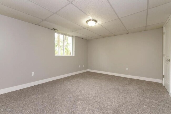Building Photo - Spacious 3BR Duplex with Finished Basement & 2-Car Garage in Otsego