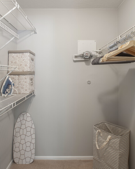 Lots of closet storage with hangers, iron and ironing board. - 2518 Cranbrook Lane