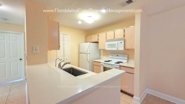 Building Photo - MOVE IN READY! LARGE 2 BEDROOM/2 BATH PLUS ATTACHED GARAGE! TILE/LVP THROUGHOUT!