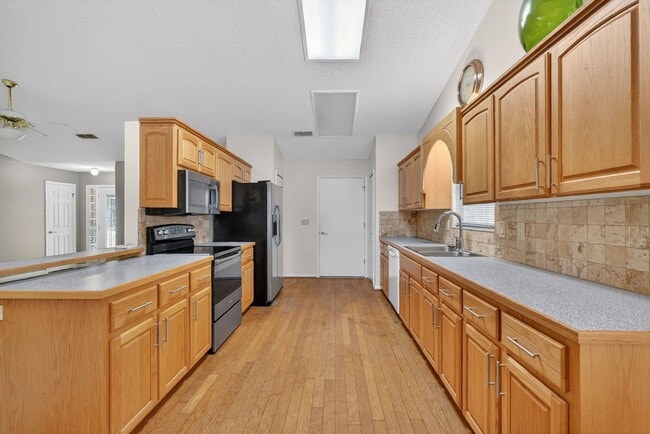 Building Photo - Available Now in Scottish Highlands | 2BR/2BA + Den in Active 55+ Community