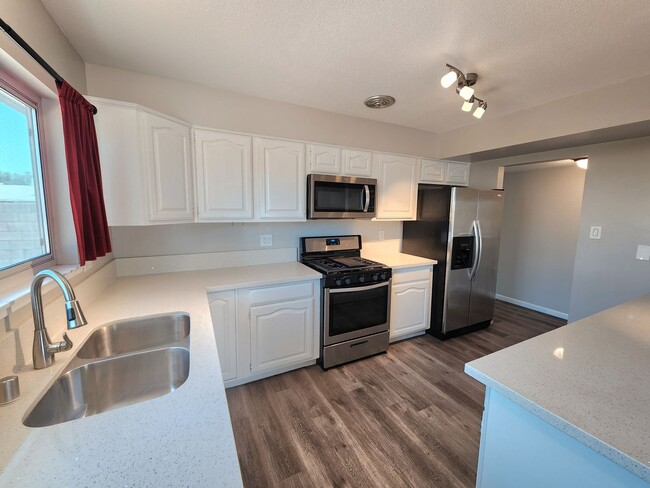 Building Photo - 4 Bedroom Two-Story Home with Downstairs Primary Bedroom & Fireplace