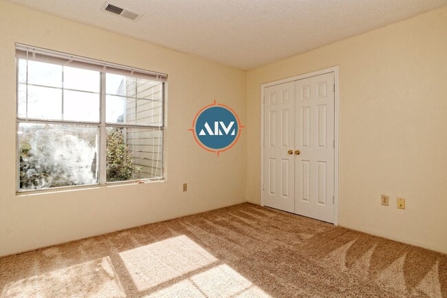 Building Photo - Charming First-Floor Condo with Pond Views at The Estate at Westbury