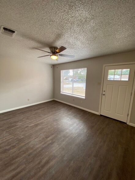 Living room and front door. New blinds throughout - 4327 Stayman Dr
