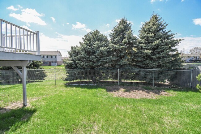 Building Photo - Updated 3BR Split-Level Home with Huge Deck, Fenced Yard & 2-Car Garage Near I-29!