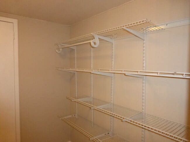 walk-in closet w/organizers - 1300 Army Navy Dr