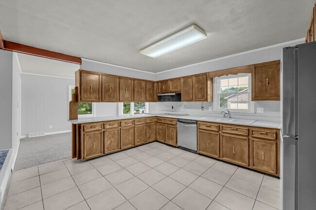 Building Photo - spacious 4-bedroom, 2.5-bath home featuring a 2-car garage and fresh updates throughout.