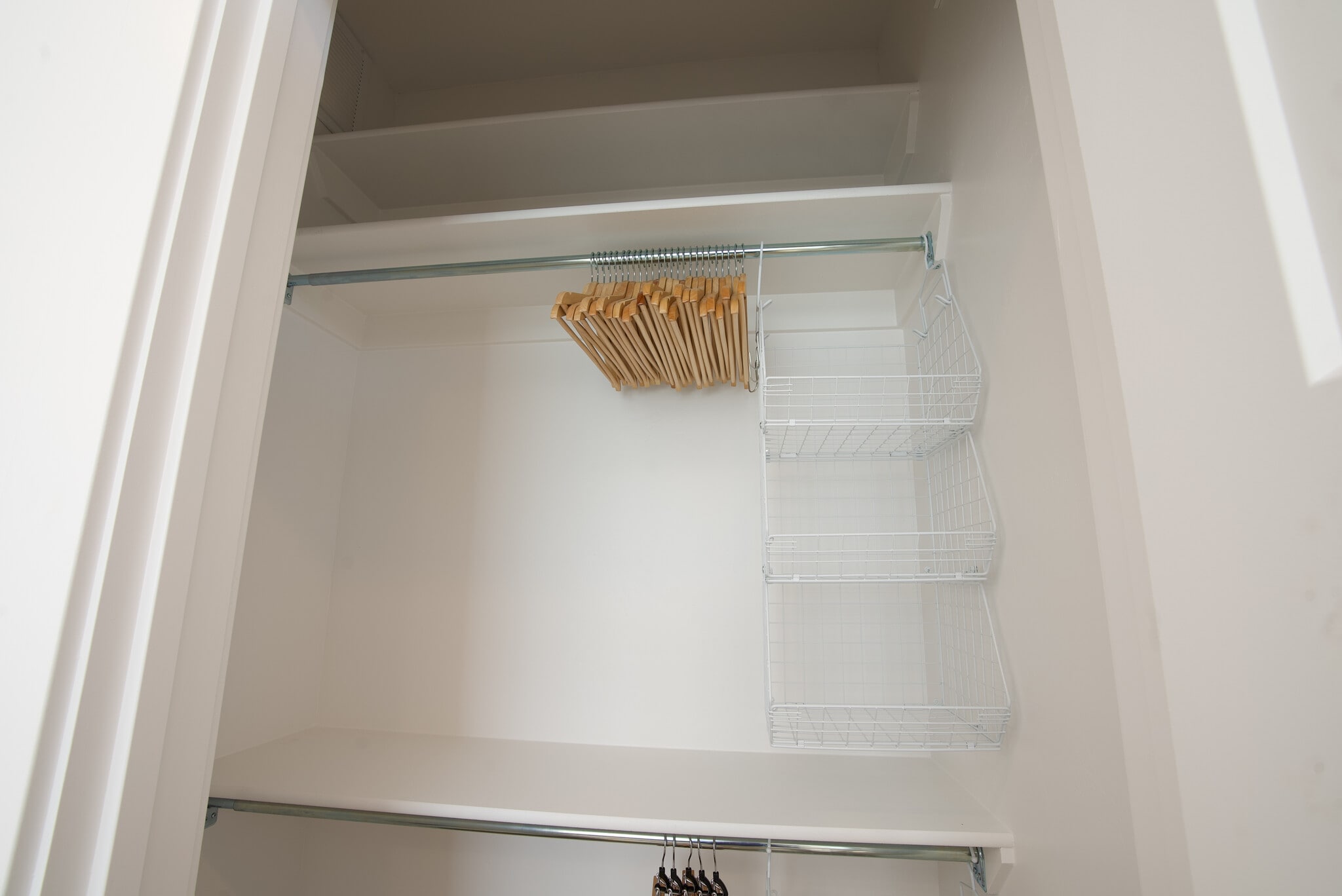 Secondary Bedroom closet with hangers and hanging bins - 525 N 1st St
