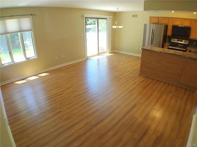 Living Room and Kitchen (Facing Backyard, First Floor) - 1730 Falcon Dr