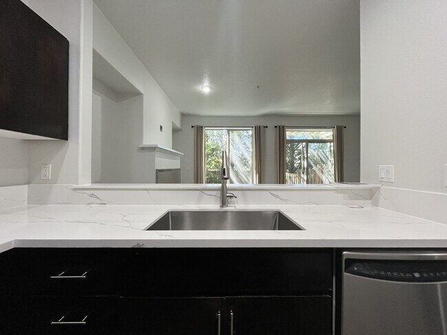 Building Photo - Beautifully Updated Bethany Townhome with Private Backyard and Modern Finishes