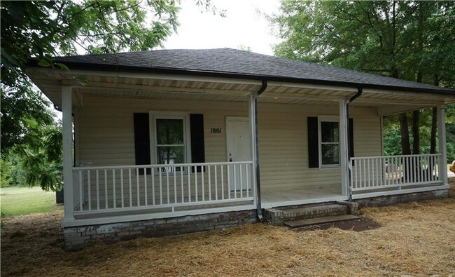 Building Photo - Quiet Home with Large COvered front porch ...