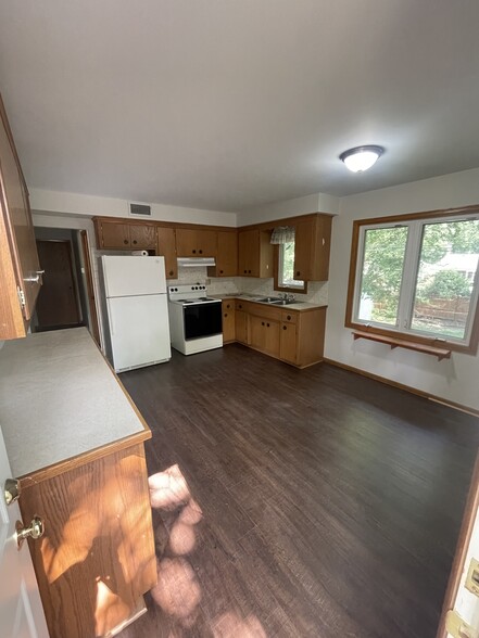 Kitchen with new flooring. - 2630 Norwood Ln N