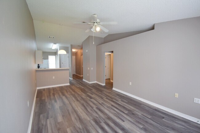 Building Photo - 2BR Patio Home with Open Layout, LVP Flooring, Private Fenced Yard, HOA Lawn Care & Convenient Bl...