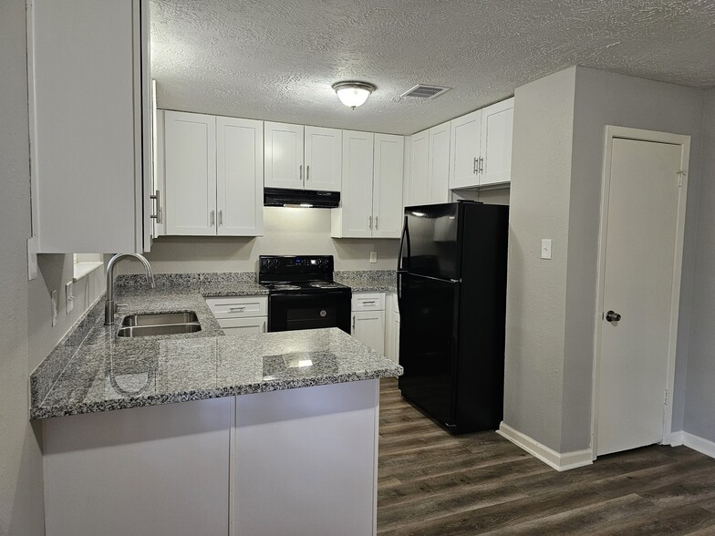 New cabinets and granite throughout the home - 9806 Thrush St