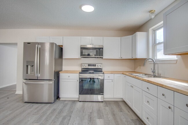 Building Photo - Stunning 4BR/2BA Pensacola Home with Private Pool, Modern Kitchen, Luxury Vinyl Flooring, Fully F...