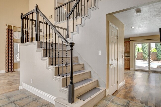 Building Photo - Gorgeous 4 Bedroom, 2 Story Home with a Beautiful Pool in the Lakes!