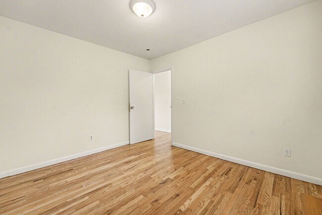 Building Photo - Spacious 3-Bedroom Home with Refinished Hardwood Floors, Fresh Interior Paint, Private Fenced Yar...