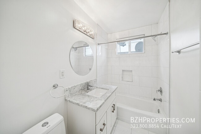 Building Photo - 7571 Willoughby Ave