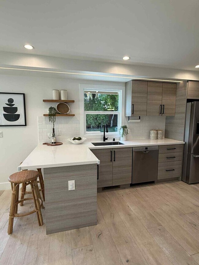 Building Photo - Modern 4-Bedroom Retreat in San Carlos – Remodeled, Spacious, Private Yard