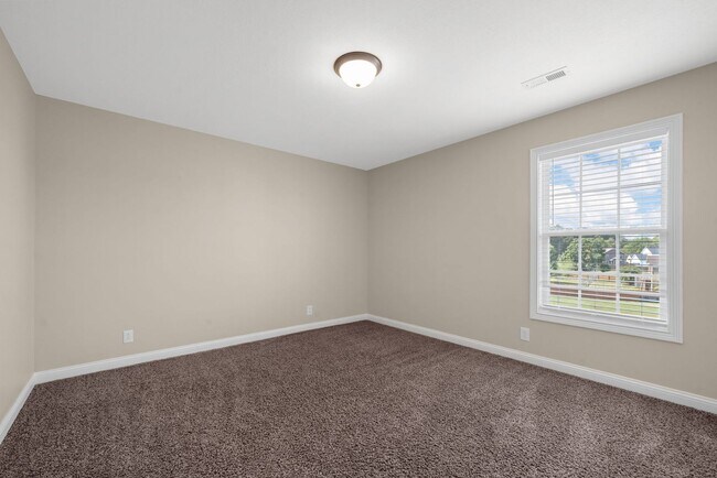 Building Photo - Spacious 4-Bedroom Home with Modern Upgrad...