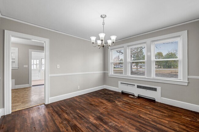 Building Photo - SW, Large Brick Two Bedroom PLUS Two Sun-Rooms, Hardwoods, LR & Separate DR, Fire Place!